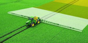 Tractor on green fields|