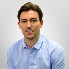 Man in blue shirt smiling