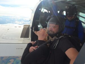 Skydiving out of plane for charity|two girls infront of manifest hut|Skydiving in sky|