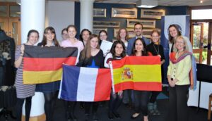Students with flags international||Students in Northampton High School