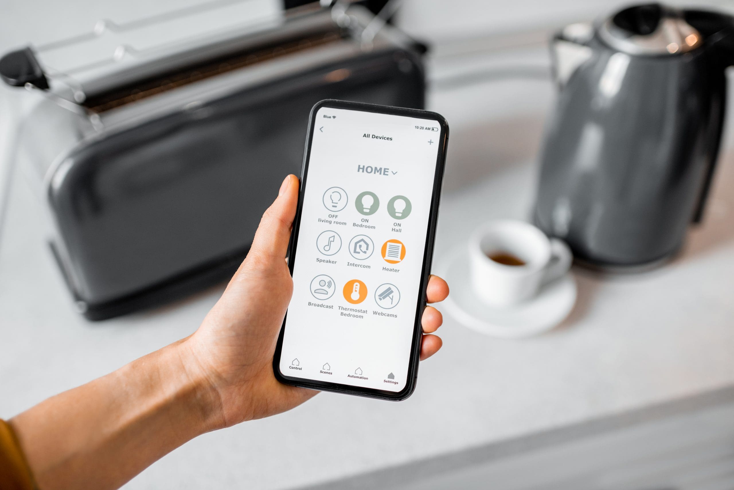 Controlling smart kitchen appliance with mobile application|Red Internet of things key on a black computer keyboard||