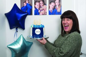 Ena woman holding cake